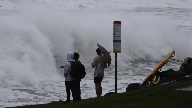 Locals brave conditions at Byron Bay. Picture: Jason O'Brien