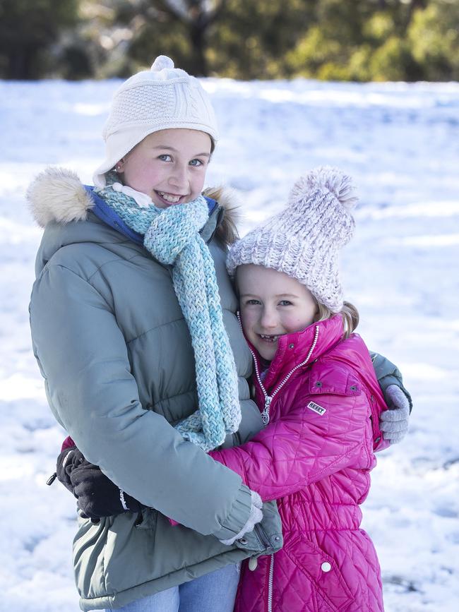 Emilie, 11, and Lina Reitz, 7, of Hobart, at Fern Tree. Picture: Chris Kidd