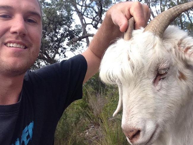 Jarred Jones gets up close and personal with one of the goats at Mt White nearly a year ago. Picture: Facebook