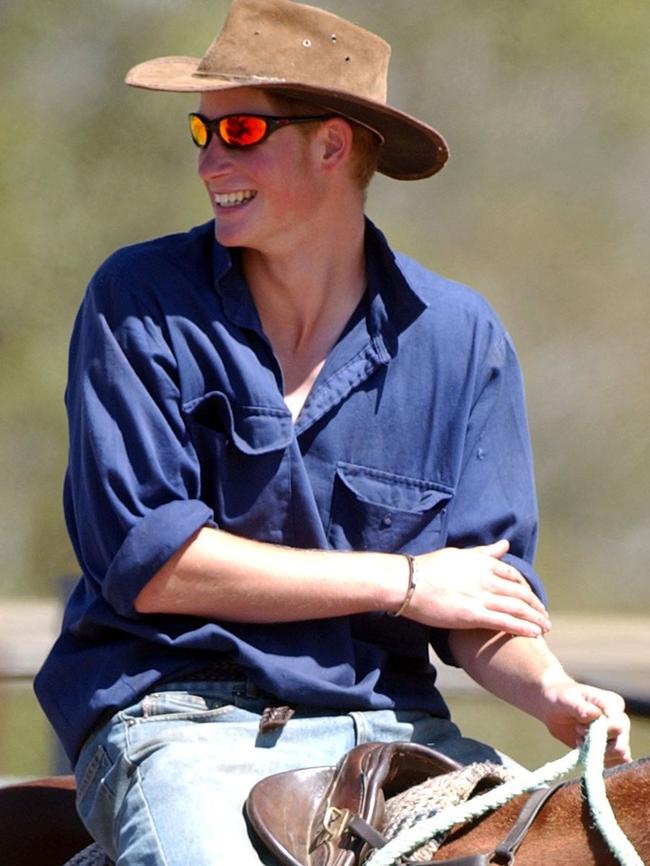 Prince Harry mustered cattle during his time as a jackaroo in Queensland in 2003. Picture: AP Photo/Steve Holland