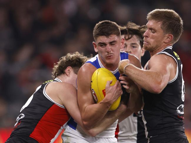 MELBOURNE, AUSTRALIA - MAY 04:  Ryan Byrnes and Sebastian Ross of the Saints tackle nm17during the round eight AFL match between St Kilda Saints and North Melbourne Kangaroos at Marvel Stadium, on May 04, 2024, in Melbourne, Australia. (Photo by Darrian Traynor/Getty Images)