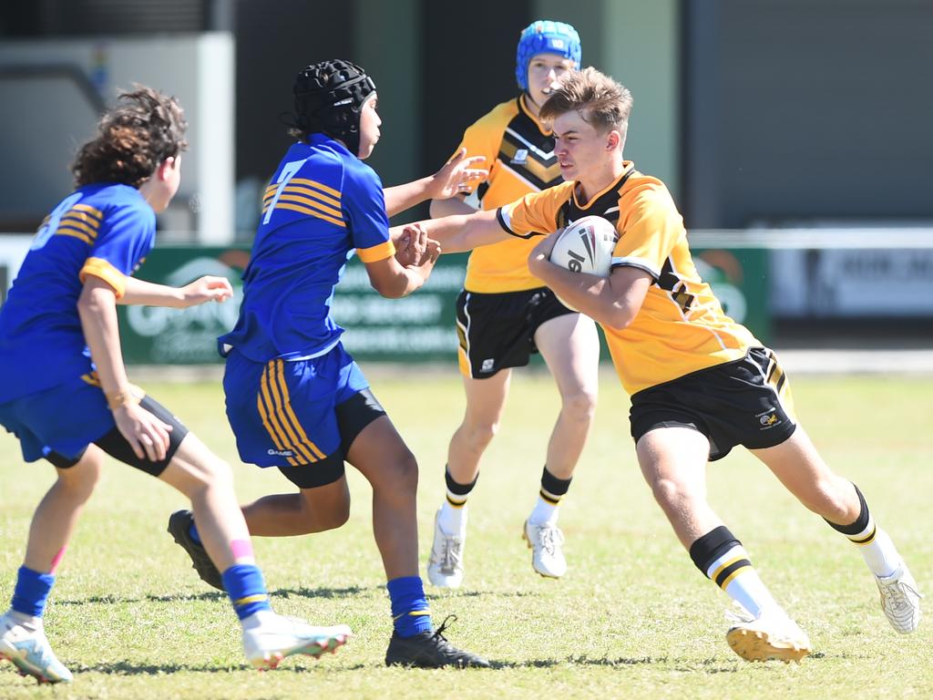 Boys Rugby League State Championship held at Northern Division, Brothers Leagues ground, Townsville. 14-15 years. Capricornia (gold) v South West (blue). Marcus Tipman of North Rockhampton SHS.