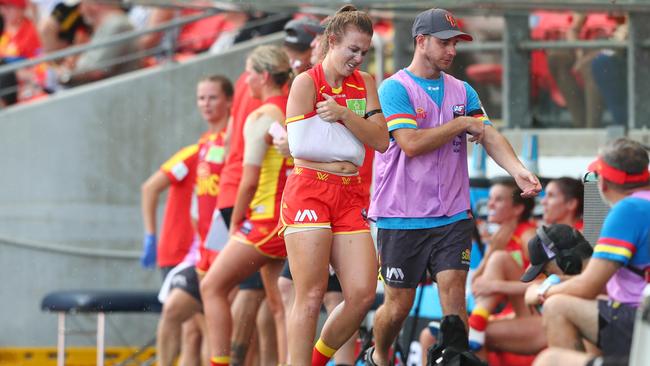 GOLD COAST, AUSTRALIA - FEBRUARY 15: Jamie Stanton of the Suns leaves the field injured during the round 2 AFLW match between the Gold Coast Suns and the Richmond Tigers at Metricon Stadium on February 15, 2020 in Gold Coast, Australia. (Photo by Chris Hyde/AFL Photos/Getty Images)