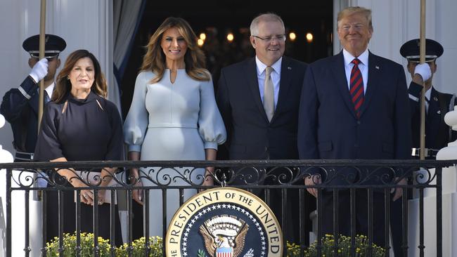 Melania Trump, wearing a Scanlan Theodore dress (second left) with President Donald Trump, Prime Minister Scott Morrison and his wife Jenny in Washington on Friday.