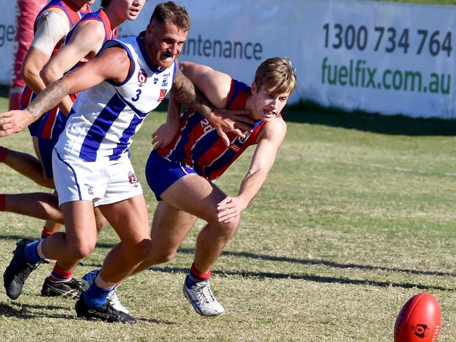 Mt Gravatt player Frazer Neate and Wilston player Tyler Galligan go for the ball. QAFL (Australian football) senior club match between Wilston Grange and Mt Gravatt. Saturday June 5, 2021. Picture: John Gass