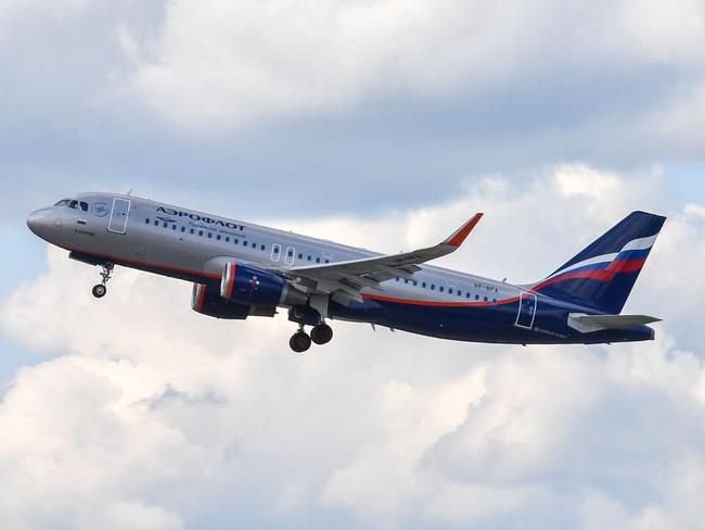 CORRECTION / An Aeroflot Airbus A320 aircraft takes off at Sheremetyevo airport outside Moscow on June 13, 2018. - Russia on February 27, 2022 closed its airspace to flights operated by carriers from Latvia, Lithuania, Estonia and Slovenia in tit-for-tat punitive measures following Moscow's invasion of Ukraine. Britain has banned Russian flagship carrier Aeroflot from flying over the UK. Meanwhile Bulgaria, Poland, the Czech Republic, the Baltics, Germany and Slovenia have closed their airspace to Russian carriers. (Photo by Yuri KADOBNOV / AFP) / âThe erroneous mention[s] appearing in the metadata of this photo by Yuri KADOBNOV has been modified in AFP systems in the following manner: [Airbus A320] instead of [Airbus A330]. Please immediately remove the erroneous mention[s] from all your online services and delete it (them) from your servers. If you have been authorized by AFP to distribute it (them) to third parties, please ensure that the same actions are carried out by them. Failure to promptly comply with these instructions will entail liability on your part for any continued or post notification usage. Therefore we thank you very much for all your attention and prompt action. We are sorry for the inconvenience this notification may cause and remain at your disposal for any further information you may require.â