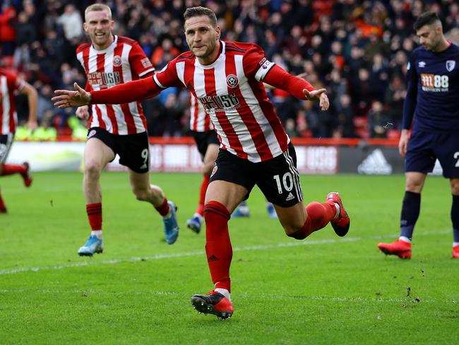 SHEFFIELD, ENGLAND - FEBRUARY 09: Billy Sharp of Sheffield United celebrates scoring his team's first goal during the Premier League match between Sheffield United and AFC Bournemouth  at Bramall Lane on February 09, 2020 in Sheffield, United Kingdom. (Photo by Richard Heathcote/Getty Images)