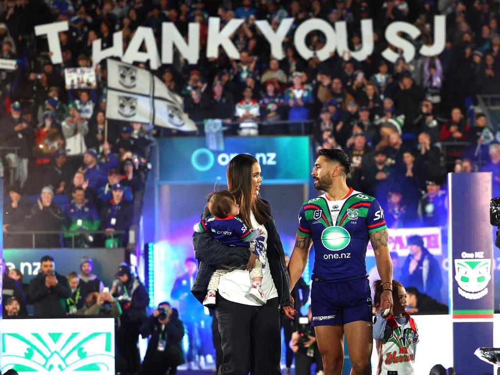 Shaun Johnson of the Warriors walks out with his family in his last game in New Zealand. Picture: Getty Images