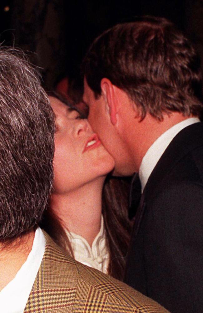 Price Andrew kissing actor Koo Stark following his official opening of the Canon Photographic Gallery at the Victoria and Albert Museum, London 19 May 1998.