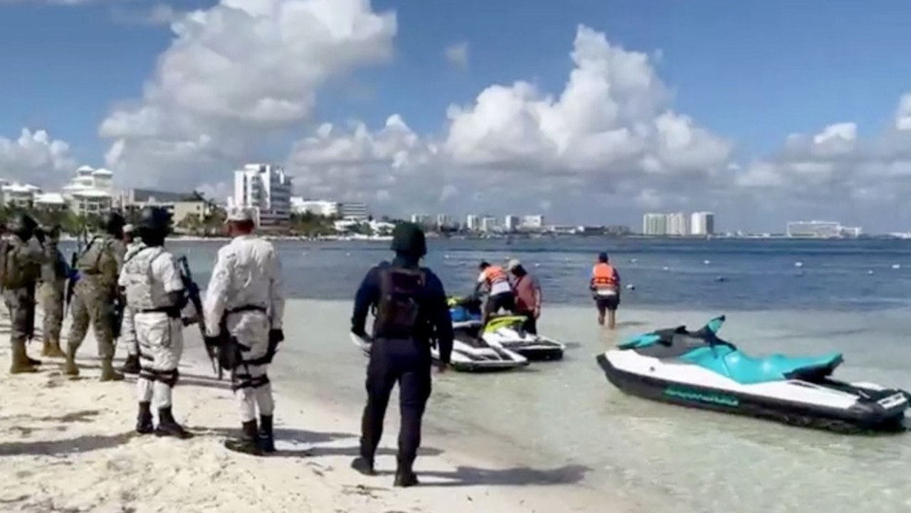 The men rode on jetskis and fired guns into the air.