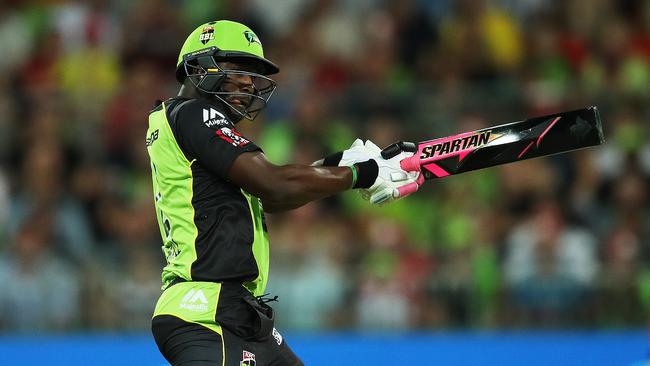 Sydney Thunder’s Andre Russell plays a shot with his black bat on Tuesday night.