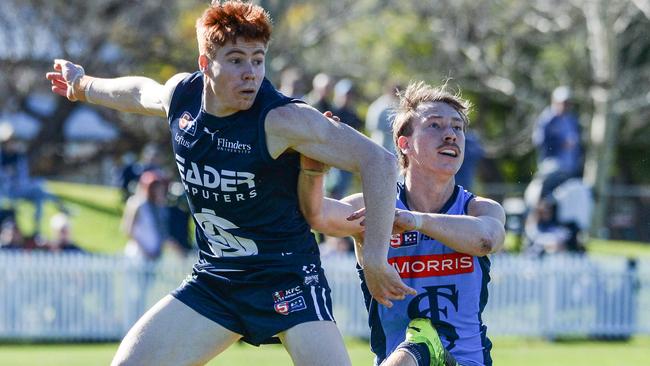 Joey Haines battles with Sturt’s Mani Liddy at Unley Oval. Picture: Brenton Edwards