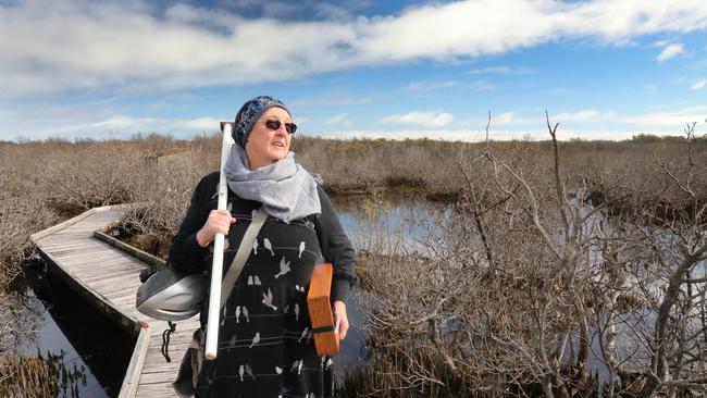 St Kilda resident and independent scientist Peri Coleman road her bike to the St Kilda Mangroves Boardwalk trail on Friday July 23, 2021. Picture Dean Martin