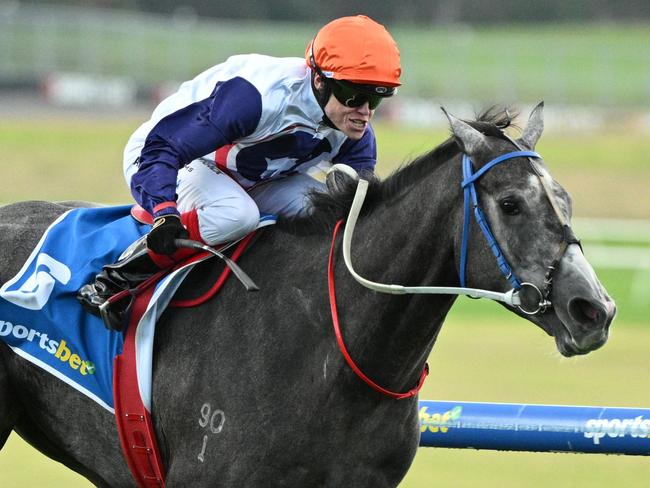 MELBOURNE, AUSTRALIA - APRIL 21: Craig Williams riding Figlio  D'Argento winning Race 3 during Melbourne Racing at Sandown Racecourse on April 21, 2025 in Melbourne, Australia. (Photo by Vince Caligiuri/Getty Images)
