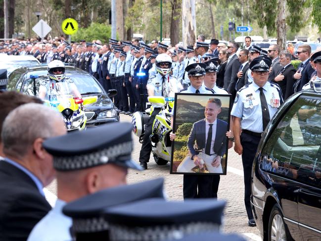 Mourners at the memorial service with full police honours for fallen constables Rachel McCrow and Matthew Arnold at Brisbane Entertainment Centre. Picture: Steve Pohlner