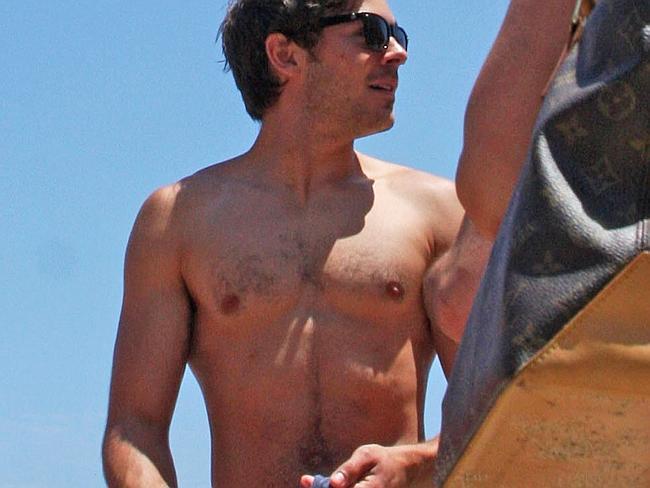 Zac Efron isn’t slip slop slapping ... but we don’t care. 