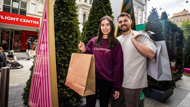 Laura Prestia and Matt Iliev taking advantage of the sales in the lead up for Christmas in Rundle Mall. Picture: Tom Huntley