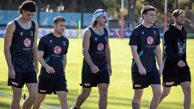 Jones, middle, walks laps at training on Monday. Picture: NCA NewsWIRE / Emma Brasier