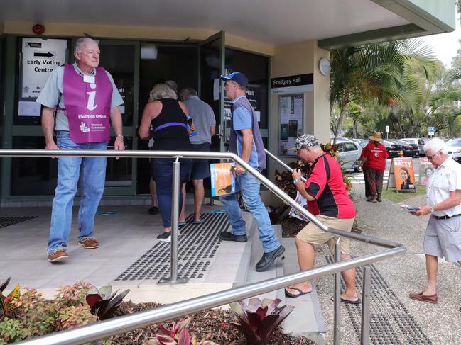 Prepoll voting opened Monday morning and the crowd flocked to  Burleigh prepoll boothto cast their vote. Candidate Wayne Bartholomew (ALP) and sitting member Michael Hart (Liberal)were there handing out how to vote cards.. Picture Glenn Hampson