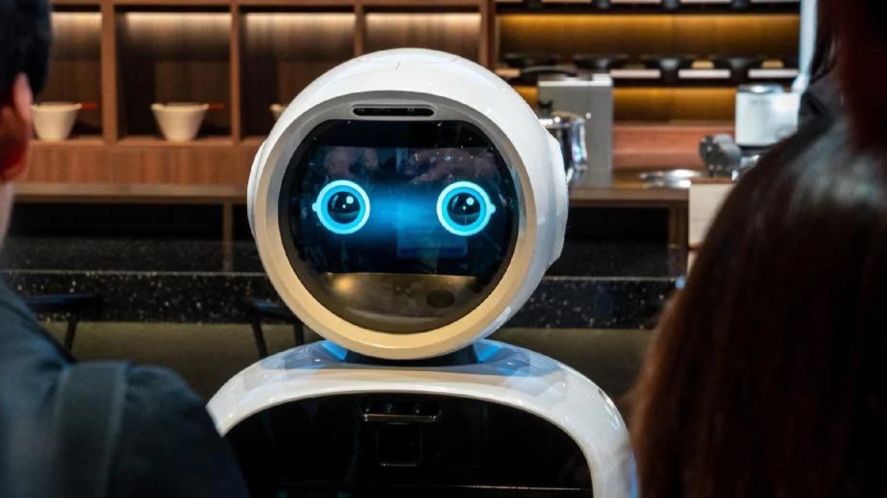 LG showed off several types of CLOi robots at the electronics show, including robots that in a mock restaurant take your order and robotic arms that prepare meals. Picture: Jennifer Dudley-Nicholson