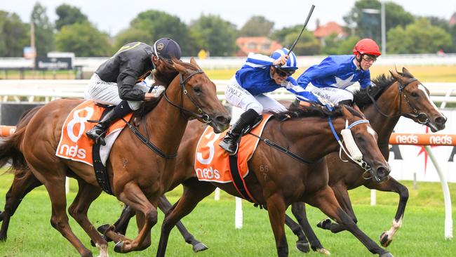 Young gun Will Price uses the whip to drive Diamonds In The Sky to victory at Caulfield. Picture: Getty Images