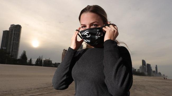 The Gold Coast now has no active coronavirus cases. Local Crystal Fox wearing her very GC mask at Broadbeach. Picture Glenn Hampson.