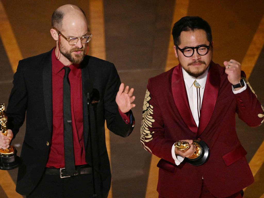 Daniel Scheinert and director Daniel Kwan accept the Oscar for Best Director for Everything Everywhere All at Once. Picture: AFP