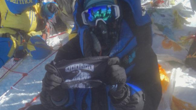 Terry Ledgard flying the Voodoo Medic flag at the summit of Mt. Everest. Picture: Supplied