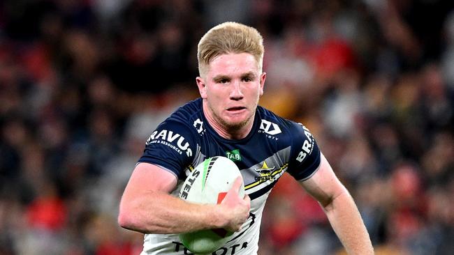 BRISBANE, AUSTRALIA - AUGUST 25: Tom Dearden of the Cowboys breaks away from the defence during the round 26 NRL match between Dolphins and North Queensland Cowboys at Suncorp Stadium on August 25, 2023 in Brisbane, Australia. (Photo by Bradley Kanaris/Getty Images)