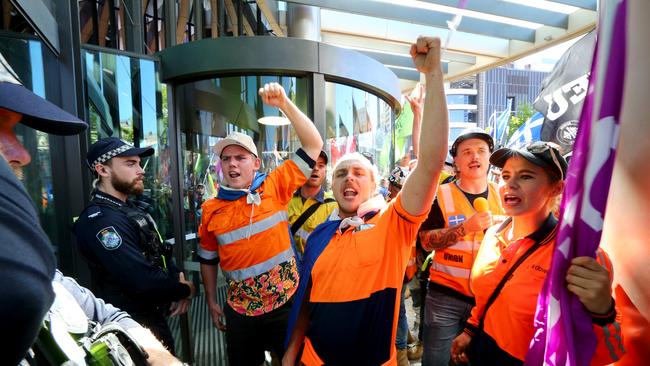 Union officials and members of the CFMEU protest outside the Queensland Premier’s office in Brisbane in early August. Picture David Clark