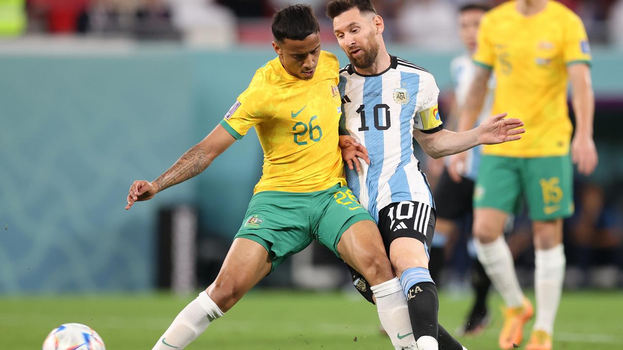 Lionel Messi of Argentina battles for possession with Keanu Baccus in Qatar. Picture: Alex Pantling / Getty Images