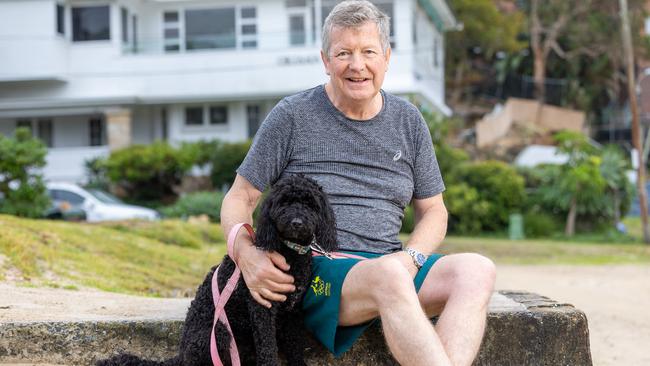 Matt Carroll, with his dog Marge on Balmoral Beach, will hand over the CEO role to Mark Arbib. Picture: Thomas Lisson