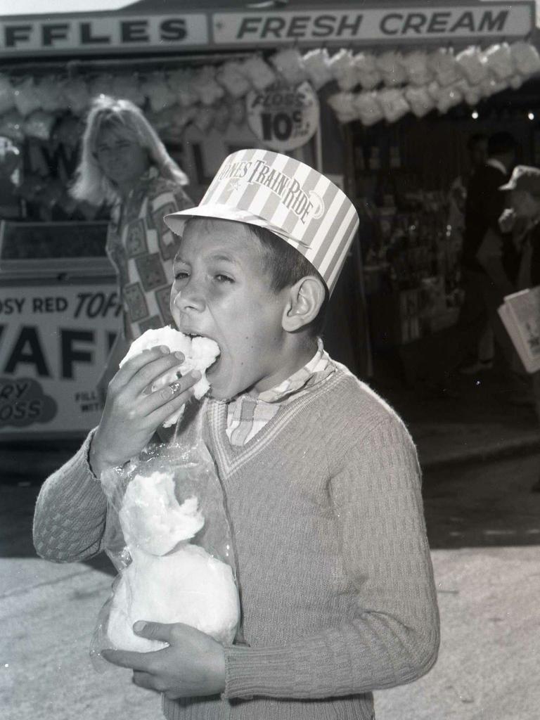 Bernard Vicic, 8, of Gailes, tries the fairy floss in 1968 on his first ever time at the Show. Picture: Keith Morris