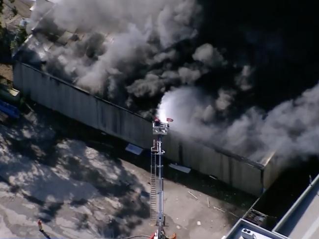 A huge blaze has engulfed an industrial warehouse in Moorebank. picture 9News