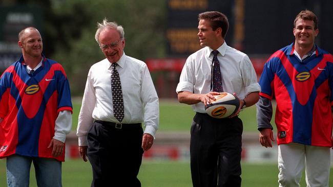 Adelaide Rams players Kerrod Walters and Willie Carne with Rupert and Lachlan Murdoch.