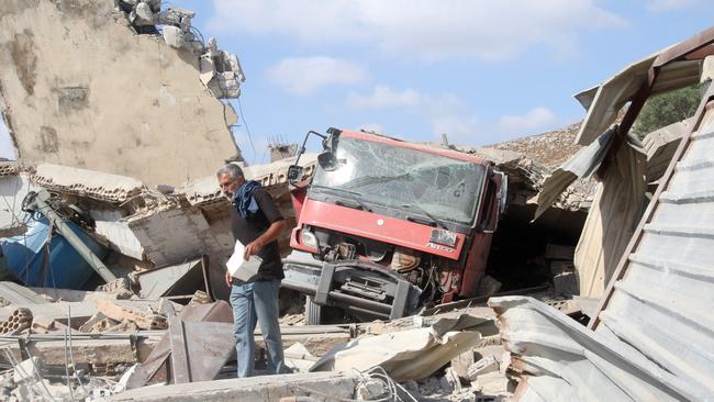 A man inspects the damage to a building after an Israeli strike in the southern town of Kfour, in the Nabatiyeh district, on August 17. Picture: AFP