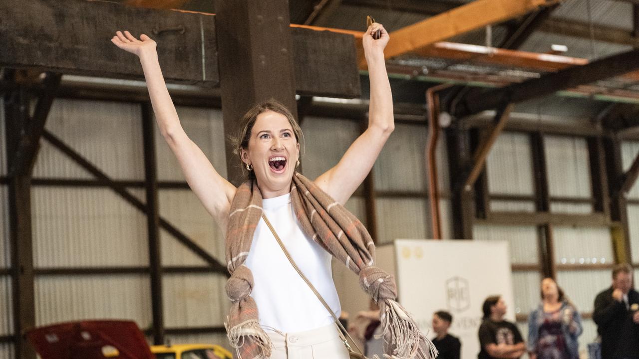 Shannon Duggan reacts after being spinner in two-up in the Goods Shed as part of Toowoomba Anzac Day commemorations, Monday, April 25, 2022. Picture: Kevin Farmer