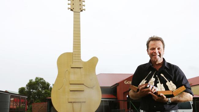 Troy Cassar-Daly in front of the Big Guitar.