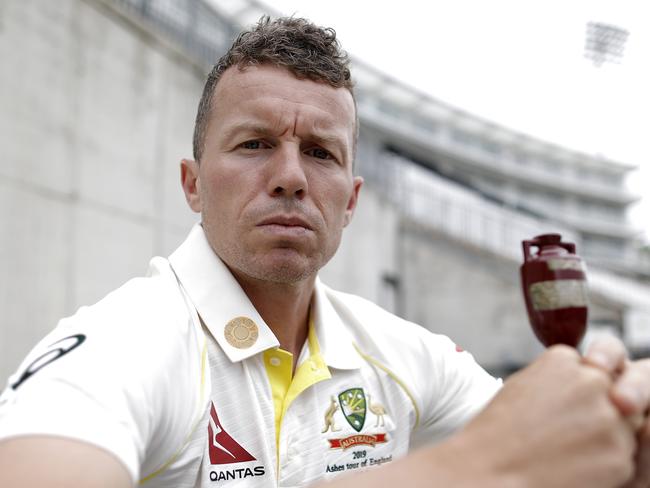 Peter Siddle with a replica Ashes urn after the Australia Ashes squad announcement.