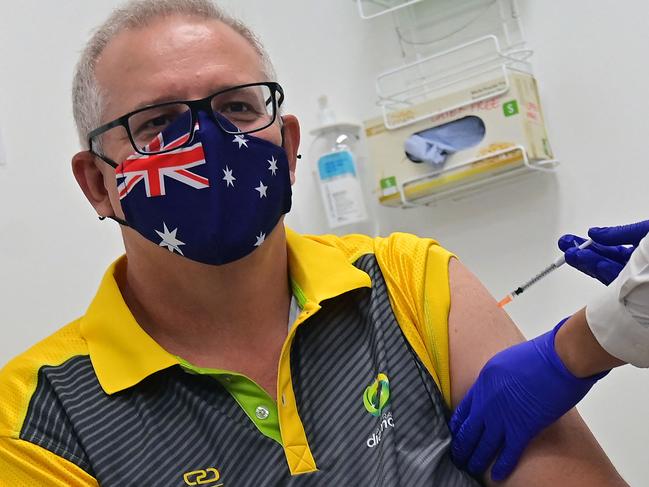 Australia's Prime Minister Scott Morrison receives a dose of the Pfizer/BioNTech Covid-19 vaccine at the Castle Hill Medical Centre in Sydney on February 21, 2021. (Photo by Steven SAPHORE / AFP)