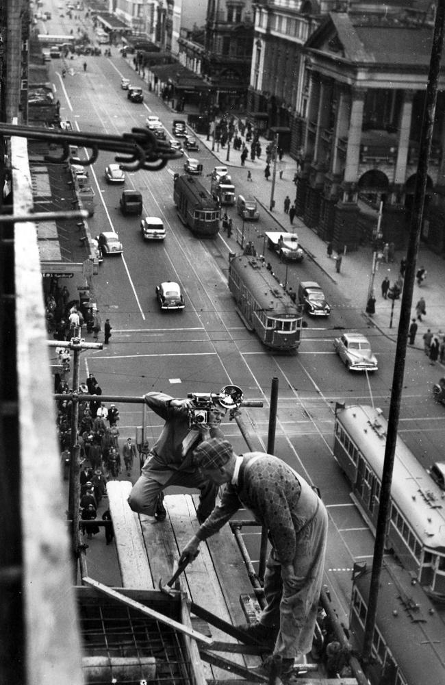 Argus photographer shoots a workman building the New Town Hall Hotel in 1954. Notice the complete lack of safety equipment. Melbourne. Picture: The Argus.