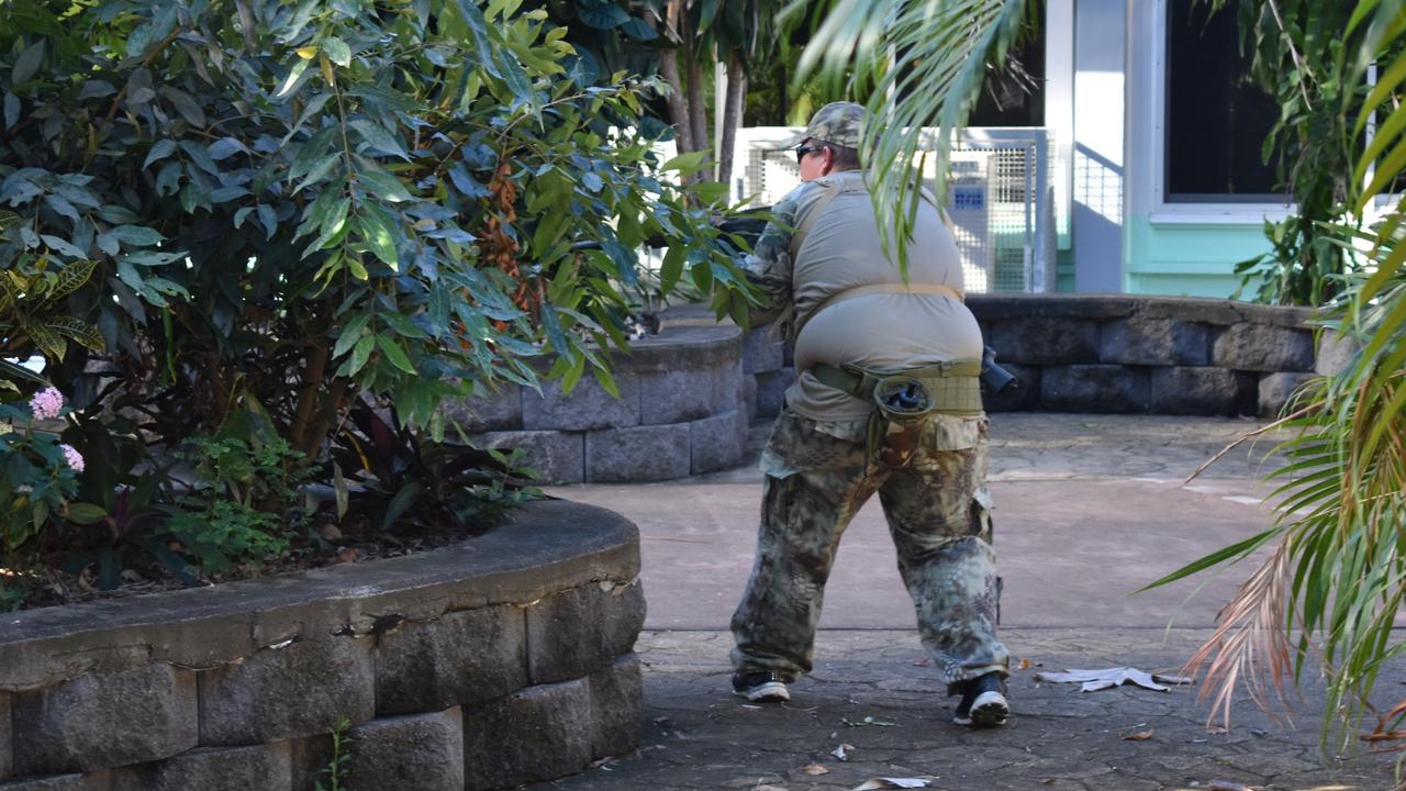 Heath Taylor peers around a garden bed inside North Mackay State High school as part of the Mackay Urban Gelsoft Games event. Photo: Janessa Ekert