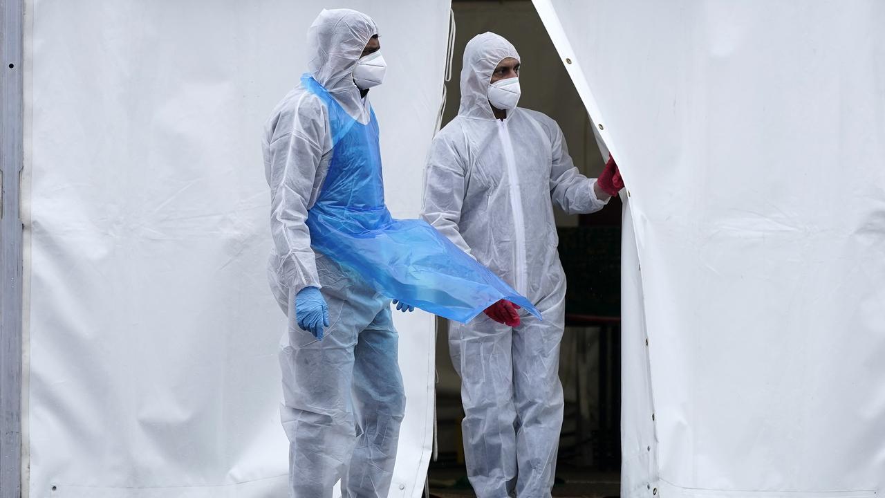 Volunteers at a temporary mortuary erected in the car park of a mosque in Birmingham, England.