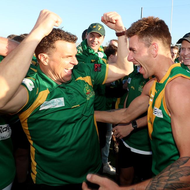 Leongatha coach Trent McMicking celebrates with his players. Picture Yuri Kouzmin