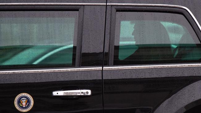 US President Donald Trump sits inside his armored limousine known as ‘The Beast’.