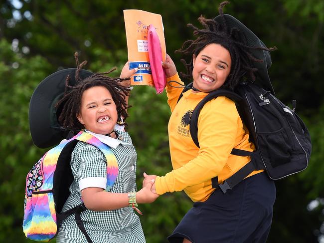 Sisters Kaya and Aisha are jumping for joy that school is returning. Picture: Josie Hayden