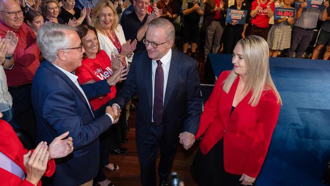ALP president Wayne Swan shakes hands with Anthony Albanese at an election rally last month, along with Jodie Haydon. Picture: Jason Edwards
