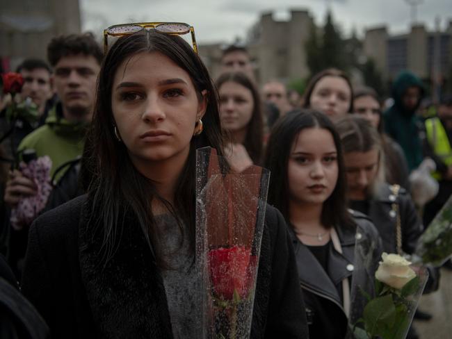 Students hold flowers as they gather at the University of Skopje. Picture: AFP