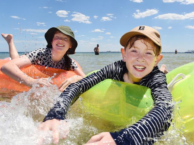 Siblings Helena, 11, and Spencer, 9, cooling off at Middle Park beach on Friday. Picture: Josie Hayden