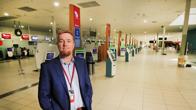 Queensland Airports Limited CEO Chris Mills in an empty Gold Coast Airport check-in area. Photo: Scott Powick.